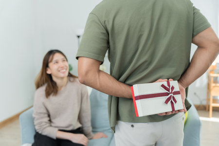 Happy husband seek and hide gift box for surprise wife. cute girl excited  gift box. birthday, Celebration, xmas, New year Festival, thank, Celebrate, Valentine's Day,の写真素材