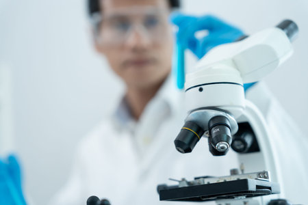 Scientist analyze biochemical samples in advanced scientific laboratory. Medical professional use...