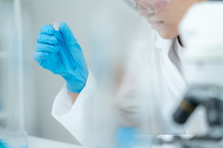 Scientist analyze biochemical sample in advanced scientific laboratory. Medical professional check chemical mix microbiological developmental of viral. Biotechnology researchの写真素材