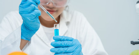 Scientist analyze biochemical samples in advanced scientific laboratory. Medical professional use...