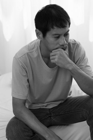 Depression and mental illness. Asian man disappoint, sad after receive bad news. Stressed boy...