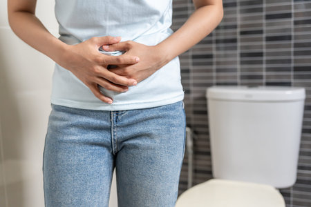 Constipation and diarrhea in bathroom. Hurt woman touch belly  stomach ache painful. colon...
