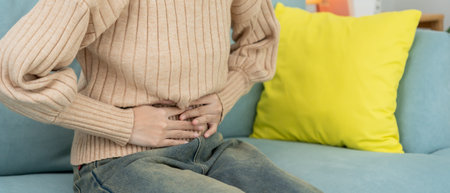 stomach ache. Asian women have abdominal pain, indigestion, gastritis, menstrual cramps, flatulence,...