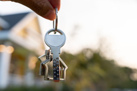 lease, rental and selling home. Real estate agent manager smile holding key for new owner. rent...