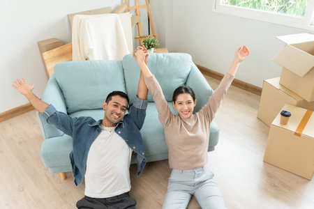 Moving house, relocation. Happy and smile Couple help set and move furniture for new apartment,...
