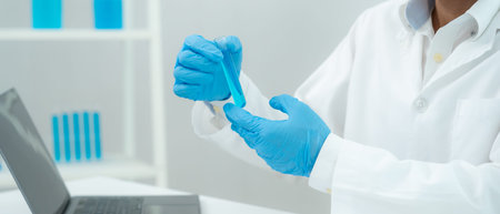 Scientist analyze biochemical sample in advanced scientific laboratory. Medical professional check...