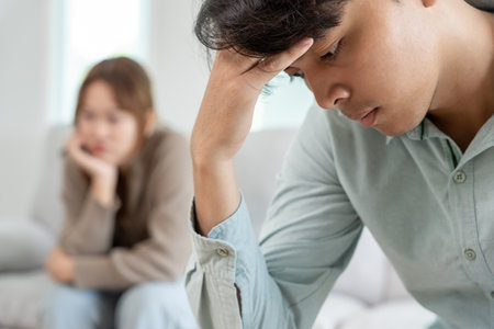 Divorce. Asian couples are desperate and disappointed after marriage. Husband and wife are sad, upset and frustrated after quarrels. distrust, love problems, betrayals.の写真素材