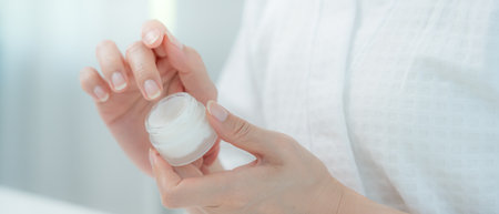 Good skin woman use cream for good skin. face of a healthy woman apply cream and makeup. Advertisement for skin cream, anti-wrinkle, baby face, whitening, moisturizerの写真素材