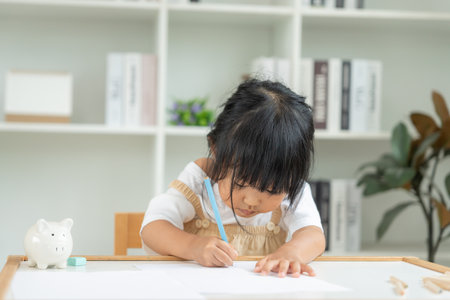 Happy Asia children learning and enjoy paint. family is happy and excited in the house. Mother and daughter having fun spending time together. Holiday, Activityの写真素材