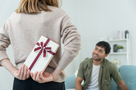 Happy wife seek and hide gift box for surprise husband. cute girl excited  gift box. birthday, Celebration, xmas, New year Festival, thank, Celebrate, Valentine's Day,の写真素材