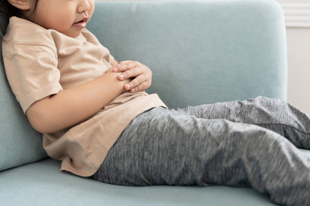 stomach ache. Children have abdominal pain, indigestion, gastritis, flatulence, diarrhea, distention, belly inflammation problem,の写真素材
