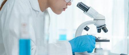 Scientist analyze biochemical samples in advanced scientific laboratory. Medical professional use...