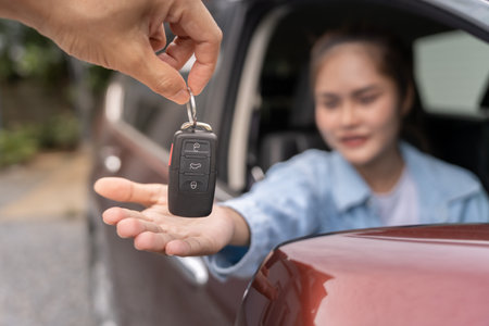 lease, rental car, sell, buy. Dealership manager send car keys to the new owner.  Sales, loan credit financial, rent vehicle, insurance,  renting, Seller, dealer, installment,の写真素材