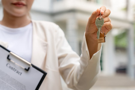 lease, rental and selling home. Real estate agent hold key for new house or real estate. rent house, Sales, loan credit financial, insurance, Seller, dealer, installment,  buy,の写真素材