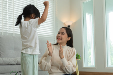 Mother day, Happy mother playing  with the little girl. Funny family is happy and excited in the house. mother and daughter have fun spending time together. holiday, weekendの写真素材