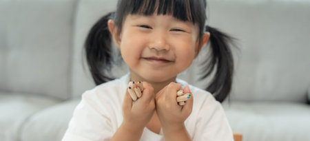 Little girl show pint, Happy children playing learn paint on paper. Activity, development, IQ, EQ,...