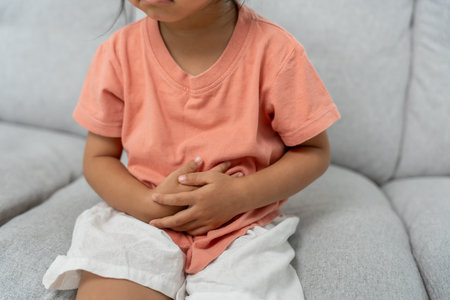 stomach ache. Children have abdominal pain, indigestion, gastritis, flatulence, diarrhea, distention, belly inflammation problem,の写真素材