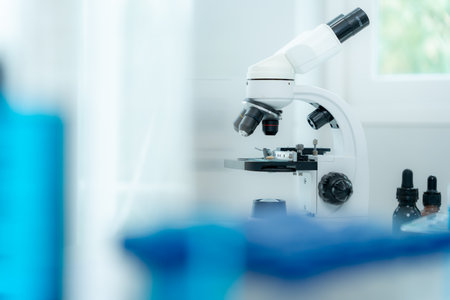 Scientist analyze biochemical samples in advanced scientific laboratory. Medical professional use microscope look microbiological developmental of viral.の写真素材