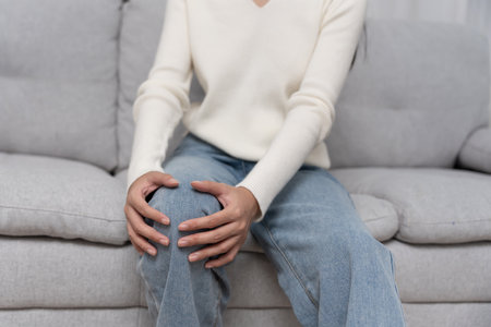 woman having knee injury due to ligament inflammation, knee pain due to exercise, massage, muscle relaxation, rheumatoid arthritis, gait disturbance, rheumatoid arthritisの写真素材