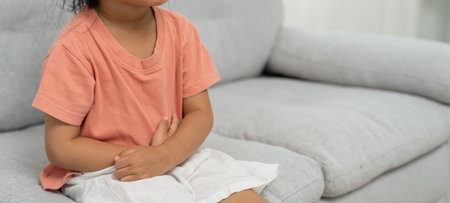 stomach ache. Children have abdominal pain, indigestion, gastritis, menstrual cramps, flatulence, diarrhea, distention, colon cancer, belly inflammation problemの写真素材