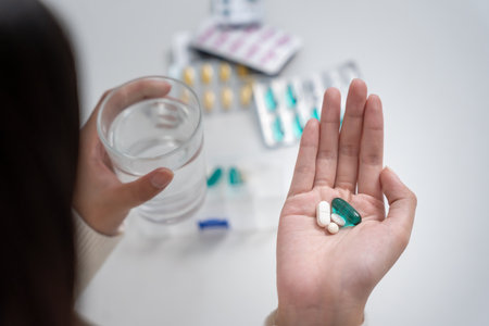 girl holding medicine and take medicine, woman tired of taking medicine, cure disease, sterilize, take vitamin, sedative, health care, Dietary supplement, medicine for medicalの写真素材