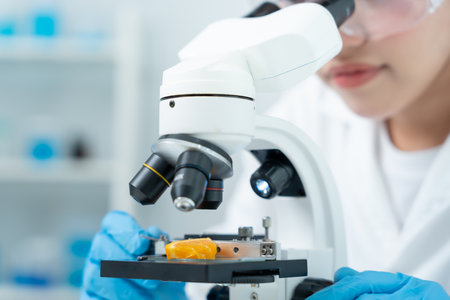 check chemical food residues in laboratory. Control experts inspect quality of fruits, vegetables. lab, hazards, ROHs, find prohibited substances, contaminate, Microscope,の写真素材