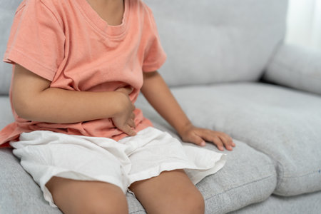 stomach ache. Children have abdominal pain, indigestion, gastritis, menstrual cramps, flatulence, diarrhea, distention, colon cancer, belly inflammation problemの写真素材