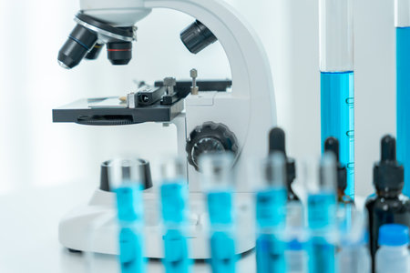 Scientist analyze biochemical samples in advanced scientific laboratory. Medical professional use microscope look microbiological developmental of viral.の写真素材