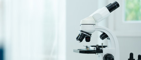 Scientist analyze biochemical samples in advanced scientific laboratory. Medical professional use microscope look microbiological developmental of viral.の写真素材