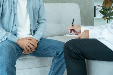 Man hold hand in front of private parts feeling discomfort from disease and inflammation. Venereal, testicular cancer. bladder problems, erectile dysfunction, premature ejaculationの写真素材