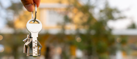 lease, rental and selling home. Real estate agent hold key for new house or real estate. rent house, Sales, loan credit financial, insurance, Seller, dealer, installment,の写真素材