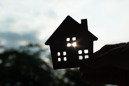 lease, rental and selling home. silhouette hand hold new house or real estate, rent house, Sales, loan credit financial, insurance, Seller, dealer, installment,  buy, sell, move inの写真素材