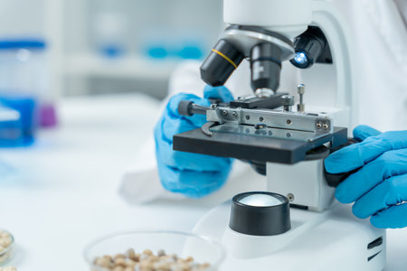 Scientist analyze biochemical samples in advanced scientific laboratory. Medical professional use...