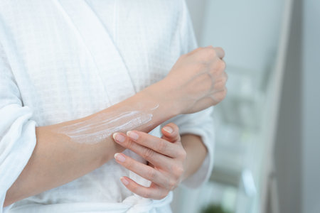 Asian woman smile use cream for good skin. healthy woman apply cream for body. Advertisement for skin cream, anti-wrinkle, baby face, whitening, moisturizer,の写真素材