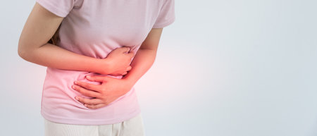 women symbol on menstrual, have abdominal pain, ache, menstrual cramps, belly inflammation problem, abdomenの写真素材