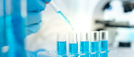 Scientist analyzes biochemical samples in advanced scientific laboratory. Medical professional uses dropper to mix microbiological developmental of viral. Biotechnologyの写真素材