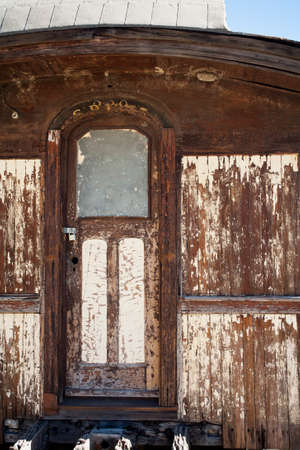 abandoned train car door weathered wood, peeling paint,の写真素材