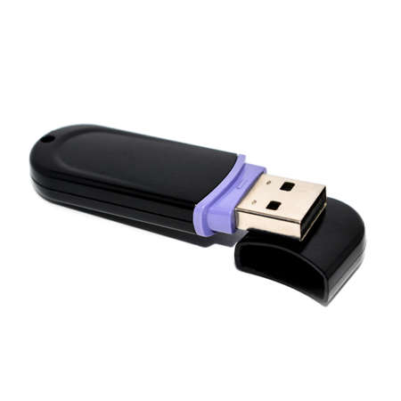 plastic usb flash drive lies on a lid on a white background
