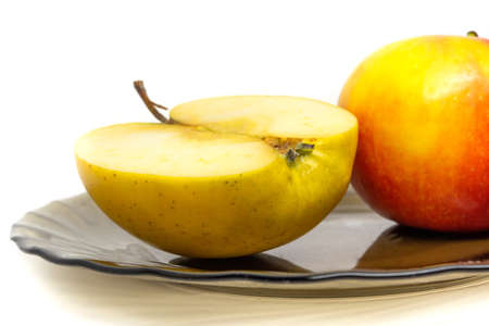 yellow red tasty fresh cut sliced half apple isolate on white