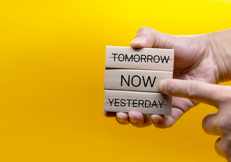 Yesterday, now, tomorrow, and now, on the wooden block, the concept is to focus