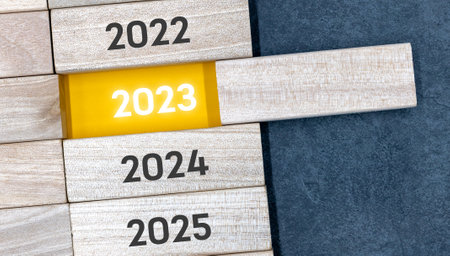 Express the process of changing to 2023 with wooden BLOCK