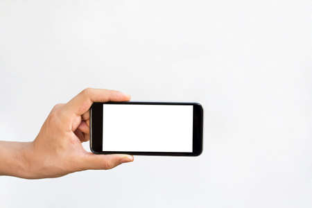 Man hand holding blank black screen isolated on white background.の写真素材