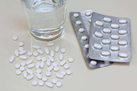 Spilled pills on white background.の写真素材