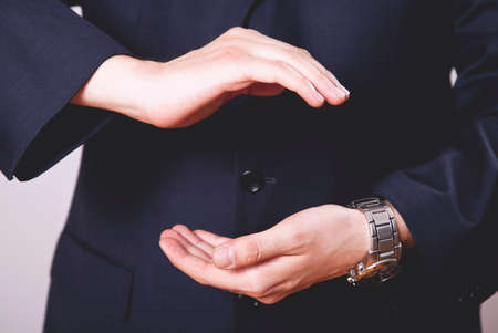 Business man hand holding something.の写真素材