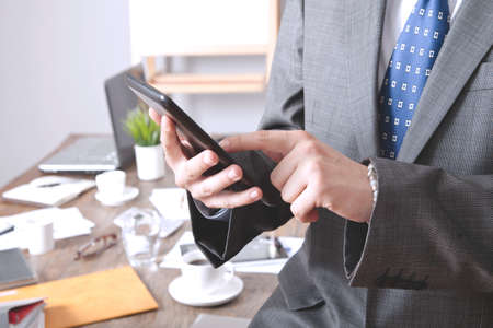 Businessman using digital tablet in office.の写真素材