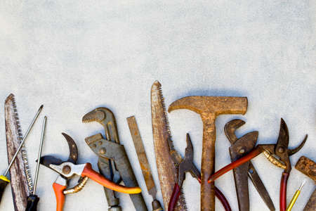 Old working tools on gray background.の写真素材