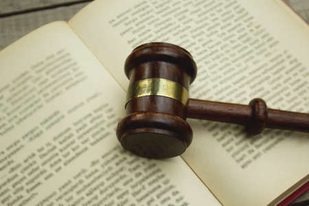 Judge gavel on open book, close up.の写真素材