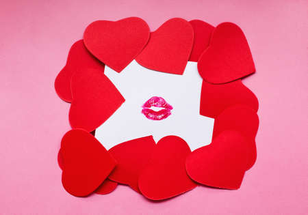 Heart shape cards on kissed white paper. Valentine day concept.の写真素材