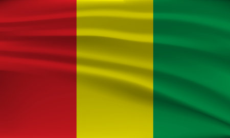 Flag of Guinea, with a wavy effect due to the wind.のイラスト素材