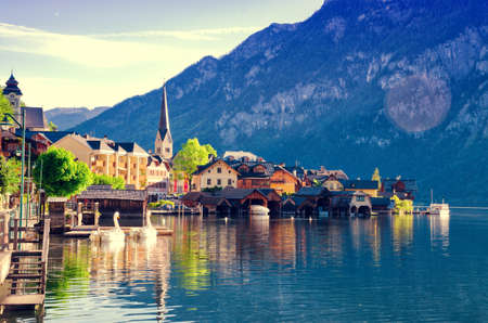 Beautiful view of Alpine Hallstatt town and Hallstattersee lake. Salzkammergut, Austria. Early morning sunrise in Hallstatt village. Filtered.のeditorial素材